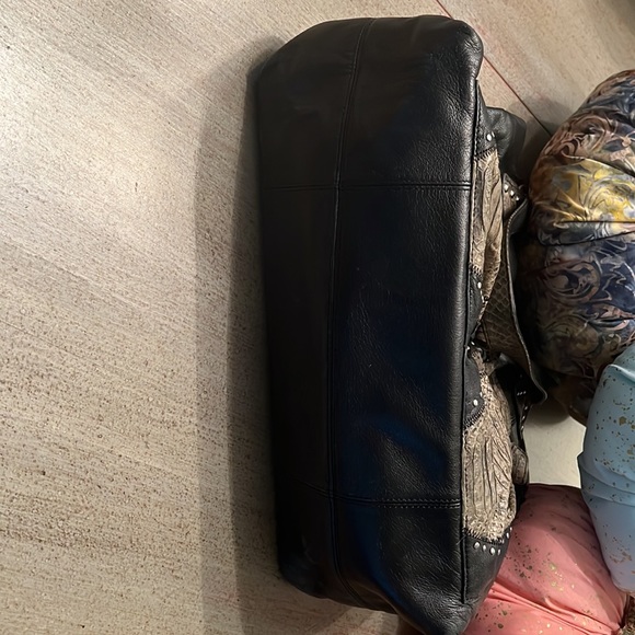 Black butter soft leather purse with grey snake handles and front pockets. - Picture 5 of 7